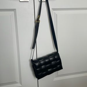 Black cassette style woven leather bag